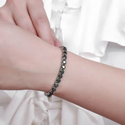 Pulseira riviera de moissanite negra no pulso
